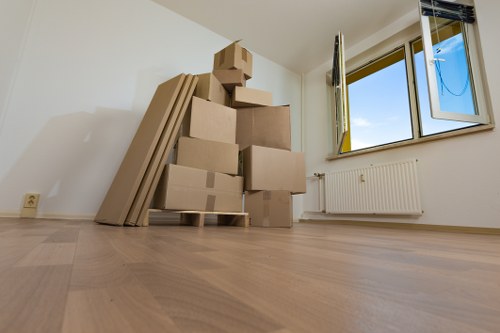 Packed boxes and furniture ready for transport in a Primrose Hill flat