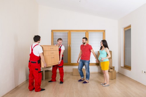 Packed boxes and furniture ready for van transport