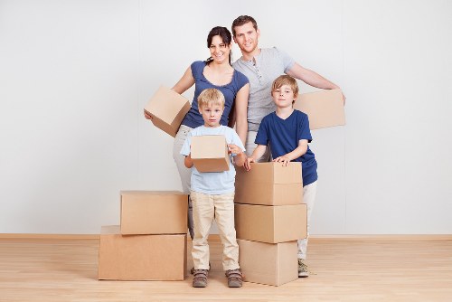 Moving van and household boxes outside a Primrose Hill property