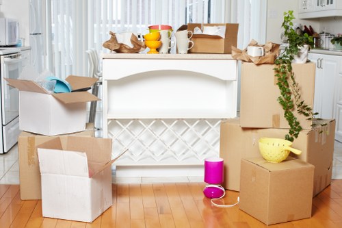 Careful wrapping of fragile household items during a Primrose Hill packing service